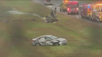 Plane crashes onto a Massachusetts highway, killing 2 on board and hurting 1 motorist